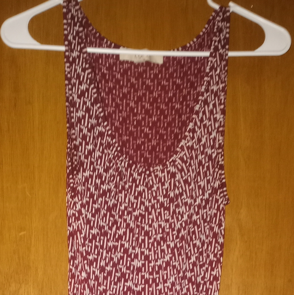 This red sundress is a size medium and made by Loft